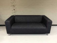 A pair of settees upholstered in a denim fabric