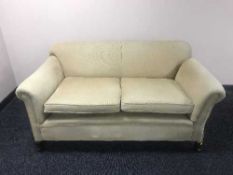 An early 20th century drop end settee