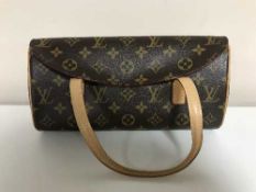 A Louis Vuitton lady's hand bag, monogram canvas, with tan trim, with press-stud single flap top,