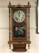 A Victorian inlaid walnut all cased wall clock