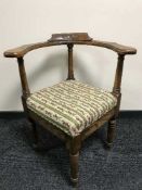 An antique oak corner chair