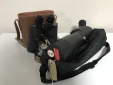 A set of cased Prinz binoculars and an Optus spotting scope on stand in carry bag