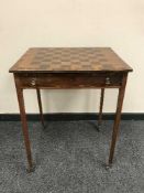 A 19th century walnut and coromandel chess table fitted a drawer on reed legs with brass cappings