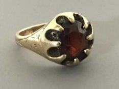 A 9ct gold garnet set ring, size M, 6.1g.