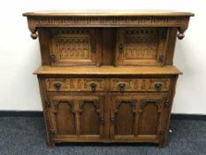 A carved oak buffet back sideboard