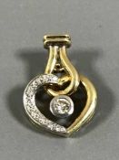 A diamond set heart pendant, 4.