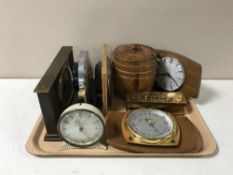 A tray containing wooden biscuit barrel, mantel clocks, barometer,