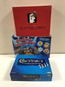 Two boxes of board games and two sets of poker chips