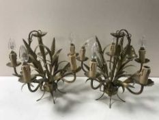A pair of gilt metal five way light fitting together with a brass and china five way light fitting,