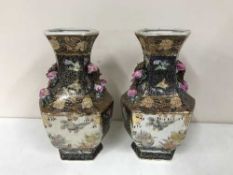 A pair of 20th century oriental vases embossed with pink flowers