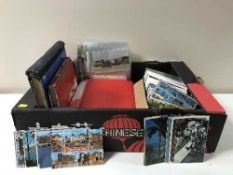 A box containing a collection of colour postcards including some relating to trains,
