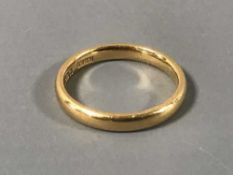 A 22ct gold band ring, 3.