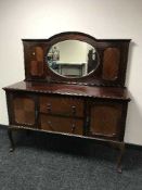 A mahogany mirror backed sideboard