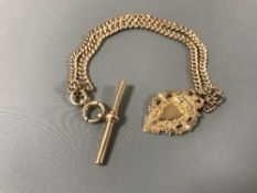 A 9ct gold Albert chain with t-bar, strung with a 9ct gold token, 39.