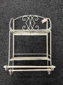 A small folding metal wall shelf