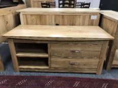A contemporary light oak sideboard
