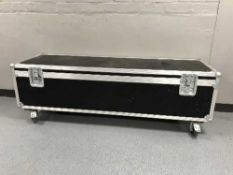 A large metal bound flight case on wheels