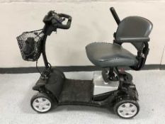 A Foru disability cart with key and charger