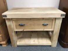 A pine butcher's block fitted with a drawer