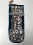 A collection of thirty-two Golly pin badges