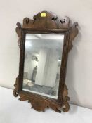 A walnut framed Chippendale style mirror