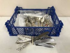 A basket of Mappin & Webb plated cutlery