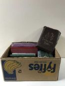 A box containing books including relating to Royalty, Holy Bible,