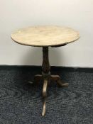 A oak pedestal occasional table