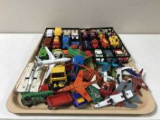 A tray of play worn die cast vehicles and planes including a Dinky Toys maximum security vehicle