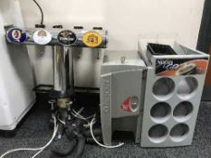 A set of beer pumps and a Nescafe coffee machine with key