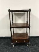A Victorian mahogany three tier what not stand