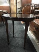 An oval mahogany occasional table