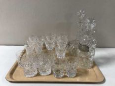 A tray containing assorted lead crystal drinking glasses together with two lead crystal decanters