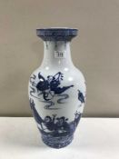 A Chinese blue and white porcelain baluster vase decorated with figures