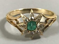 An 18ct gold emerald and diamond ring