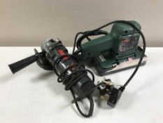 A box of assorted power tools, security lights,