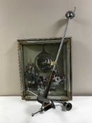 A railway light fitting with glass shades and a framed print