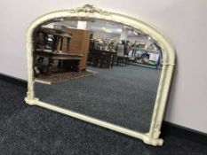 A cream framed over mantel mirror