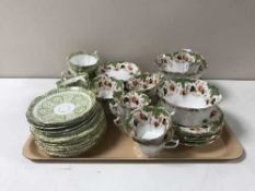 A tray containing two English part tea services