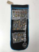 A collection of thirty-three Golly pin badges