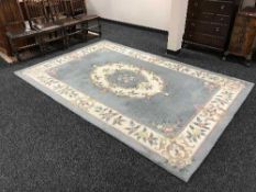 A woollen Chinese embossed carpet on blue ground