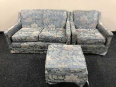 A five piece lounge suite upholstered in floral fabric