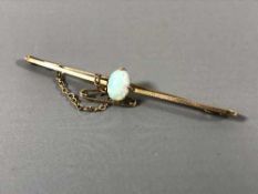 A 15ct gold opal set bar brooch