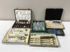 A tray containing boxed table cutlery