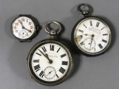 A silver trench style wristwatch and two silver open faced pocket watches