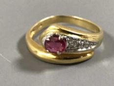 An 18ct gold ruby and diamond snake ring, 4.