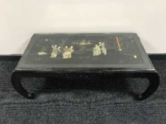 An oriental lacquered table depicting Geisha