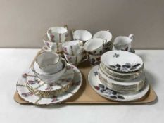 A tray containing Dorcester and Royal Vale china tea services