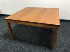 A late 20th century teak coffee table and four dining chairs