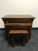 A nest of three pine tables